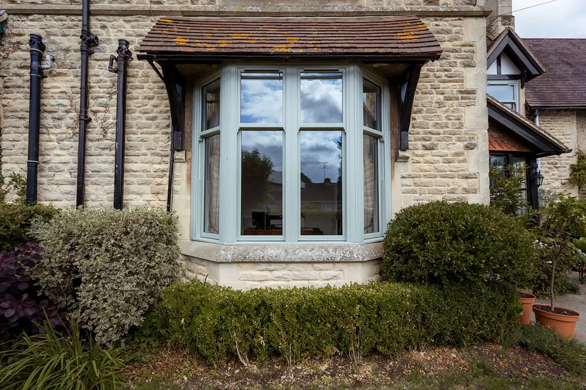 Traditional bay sash window with double glazing in Northampton home exterior.