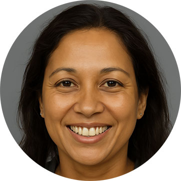 Smiling woman with dark hair against a grey background.