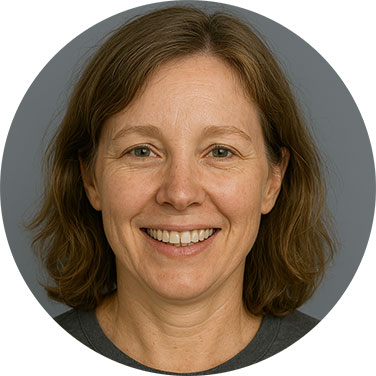 Smiling middle-aged woman with short brown hair against a neutral background
