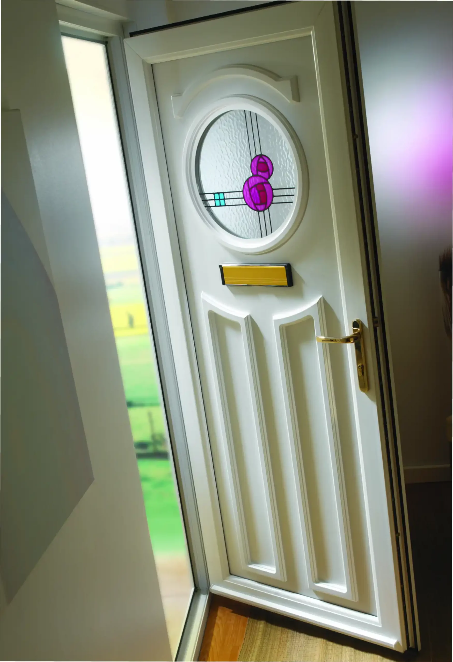 White uPVC front door with oval stained glass design and gold handle, viewed from inside.