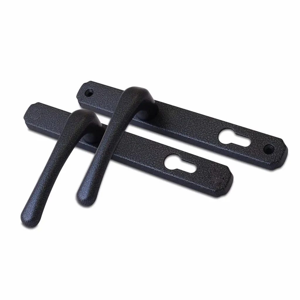 Antique black heritage door handles with textured finish and long backplates.