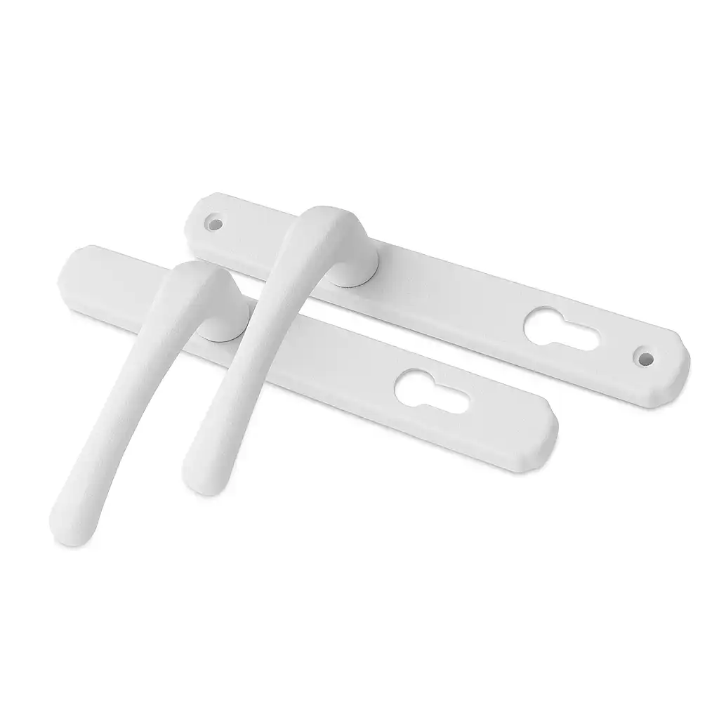 White heritage-style door handles with long rectangular backplates and keyhole cutouts.